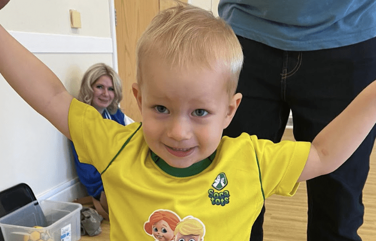 Sports for toddlers. Image shows a toddler in Socatots class uniform.