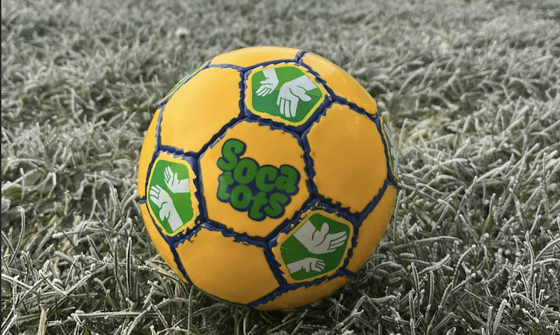 Things to do with a toddler near me. Image shows a Socatots football on a frosty grass pitch.