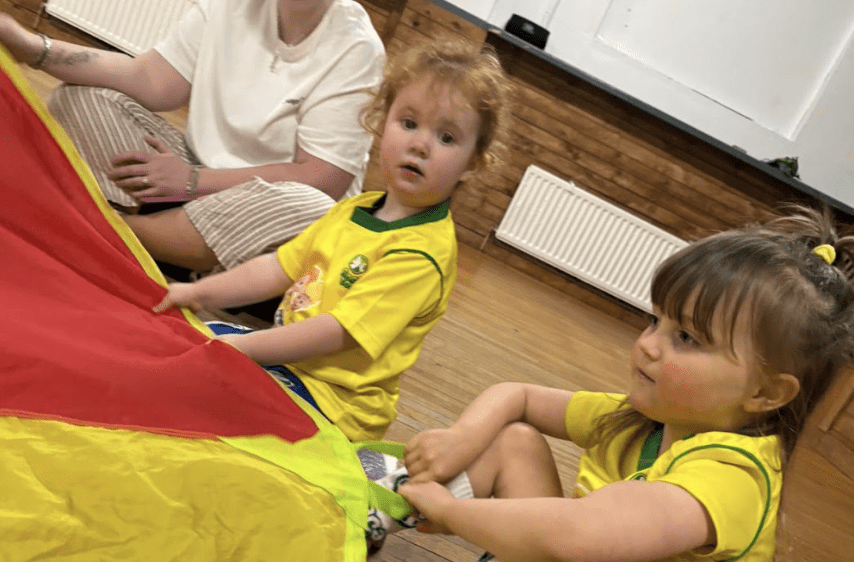 Toddler football class length. Image shows two toddlers at a Socatots class.