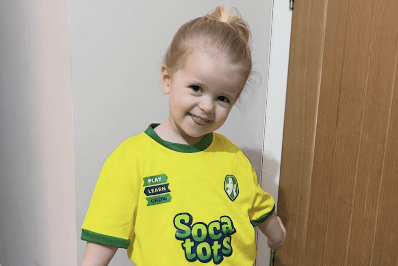 Children's football club in Bristol. Image shows a young girl ready for her Socatots class in Socatots uniform.